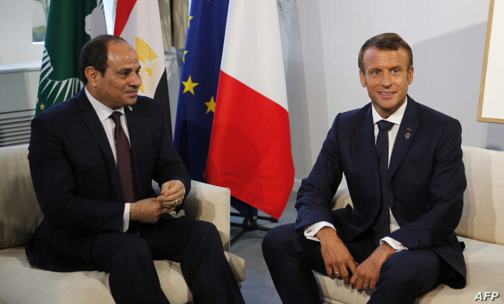 Egyptian President and Chairman of the African Union Abdel Fattah al-Sissi (L) and French President Emmanuel Macron pose prior to their a bilateral meeting in Biarritz, south-west France on August 26, 2019, on the third day of the annual G7 Summit. (Photo by Francois Mori / POOL / AFP)